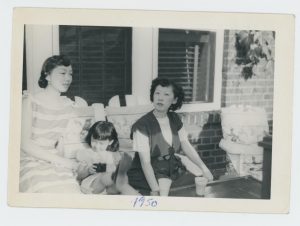 Victoria Moy, Ellyn Chan, and Sophia Chan relaxing on their patio in Forest Hills, 1950.